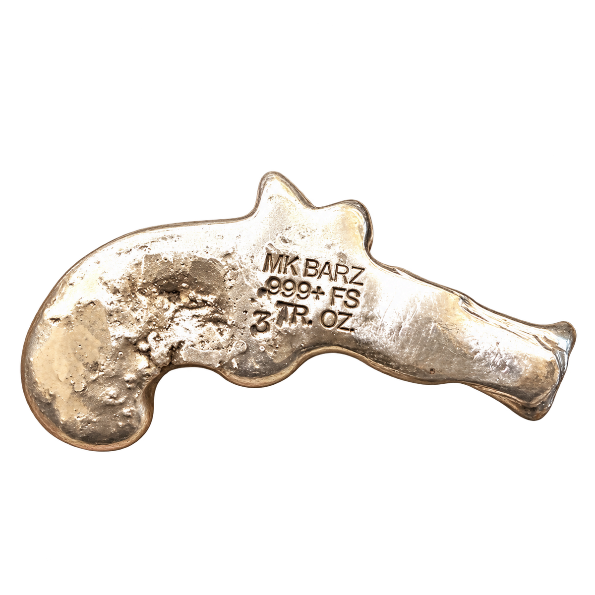 A 3 Troy ounce gold bullion bar shaped like a revolver pistol, showing a textured, hammered surface with an engraved maker's mark 'MK BARZ' and purity '999+ FS'.